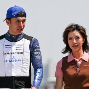 Alexander Albon of Thailand and Atlassian Williams Racing walks with his girl friend Lily He Muni in the paddock during Sprint ahead of the F1 Grand Prix of CHINA at Shanghai International Circuit