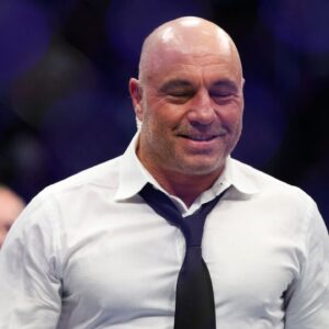 Joe Rogan after the fight between Amir Albazi (red gloves) and Francisco Figueiredo (blue gloves) during UFC 278 at Vivint Arena.