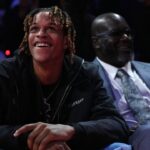 Shaquille O'Neal sits with his son Shareef O'Neal during the fourth quarter of the game between the New Orleans Pelicans and the Los Angeles Lakers in the NBA In Season Tournament Semifinal at T-Mobile Arena.