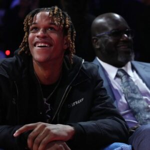 Shaquille O'Neal sits with his son Shareef O'Neal during the fourth quarter of the game between the New Orleans Pelicans and the Los Angeles Lakers in the NBA In Season Tournament Semifinal at T-Mobile Arena.