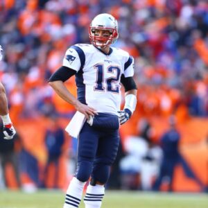 Jan 24, 2016; Denver, CO, USA; New England Patriots quarterback Tom Brady (12) with tight end Rob Gronkowski (87) and wide receiver Julian Edelman (11) against the Denver Broncos in the AFC Championship football game at Sports Authority Field at Mile High.