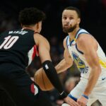 Golden State Warriors guard Stephen Curry (30) dribbles the ball during the first half against Portland Trail Blazers forward Justin Minaya (10) at Moda Center.