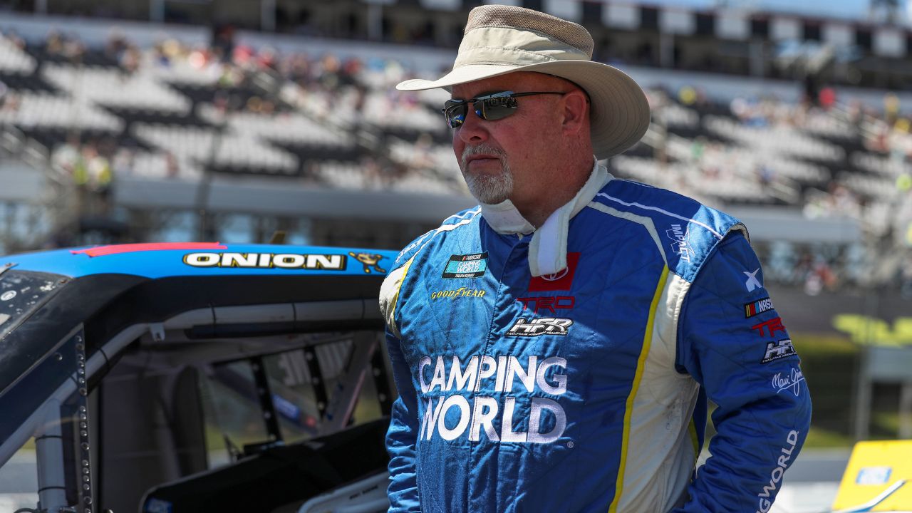 Former NASCAR Camping World Truck Series driver Todd Bodine stands on pit road prior to the CRC Brakleen 150 at Pocono Raceway. It is his 800th and final scheduled start in NASCAR national series races in his career. Mandatory Credit: Matthew OHaren-Imagn Images