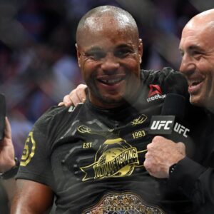 Daniel Cormier (blue gloves) celebrates beating Stipe Miocic (red gloves) during UFC 226 at T-Mobile Arena.