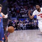 Cade Cunningham (L), Malik Beasley (R)