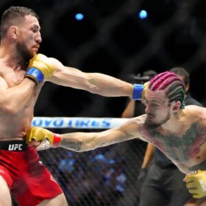 Sean OíMalley of the United States (red gloves) fights Merab Dvalishvili of Georgia (blue gloves) during Riyadh Season Noche UFC 306 at The Sphere.