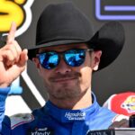 NASCAR Xfinity Series driver Kyle Larson (88) tries on a cowboy hat in Victory Lane after he wins the NASCAR Xfinity race at Texas Motor Speedway.