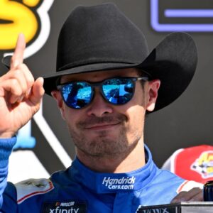NASCAR Xfinity Series driver Kyle Larson (88) tries on a cowboy hat in Victory Lane after he wins the NASCAR Xfinity race at Texas Motor Speedway.