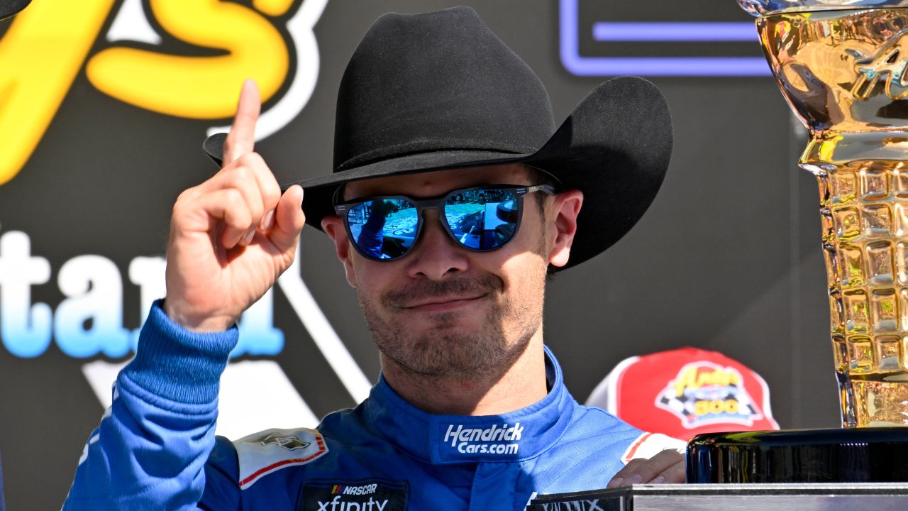 NASCAR Xfinity Series driver Kyle Larson (88) tries on a cowboy hat in Victory Lane after he wins the NASCAR Xfinity race at Texas Motor Speedway.