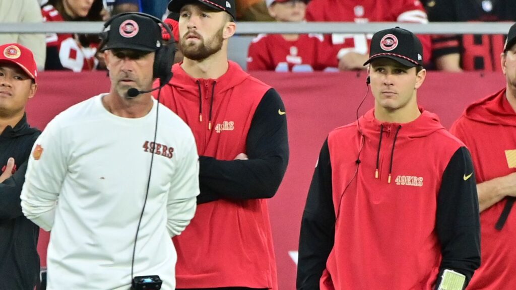 San Francisco 49ers quarterback Brock Purdy (right) and head coach Kyle Shanahan (left) look on the in second half against the Arizona Cardinals at State Farm Stadium.