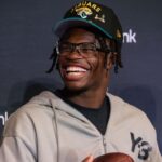 Jacksonville Jaguars first round draft pick Travis Hunter talks to the media during a press conference at Miller Electric Center.