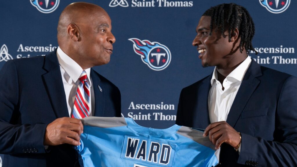 NFL Hall of Fame quarterback Warren Moon, left, poses for pictures with Cam Ward who earlier had been introduced as the Tennessee Titans first-round pick – and overall number one pick – in the NFL Draft at Ascension Saint Thomas Sports Park in Nashville, Tenn., Friday, April 25, 2025. Moon, whose No. 1 jersey is retired for the Tennessee Titans, allowed Ward to wear his number.