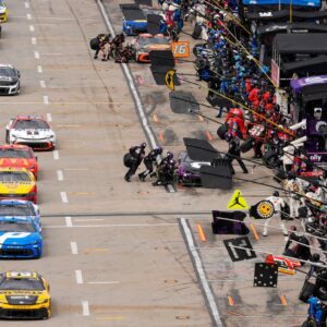 NASCAR cars come down pit road for service during the Cook Out 400 at Martinsville Speedway.
