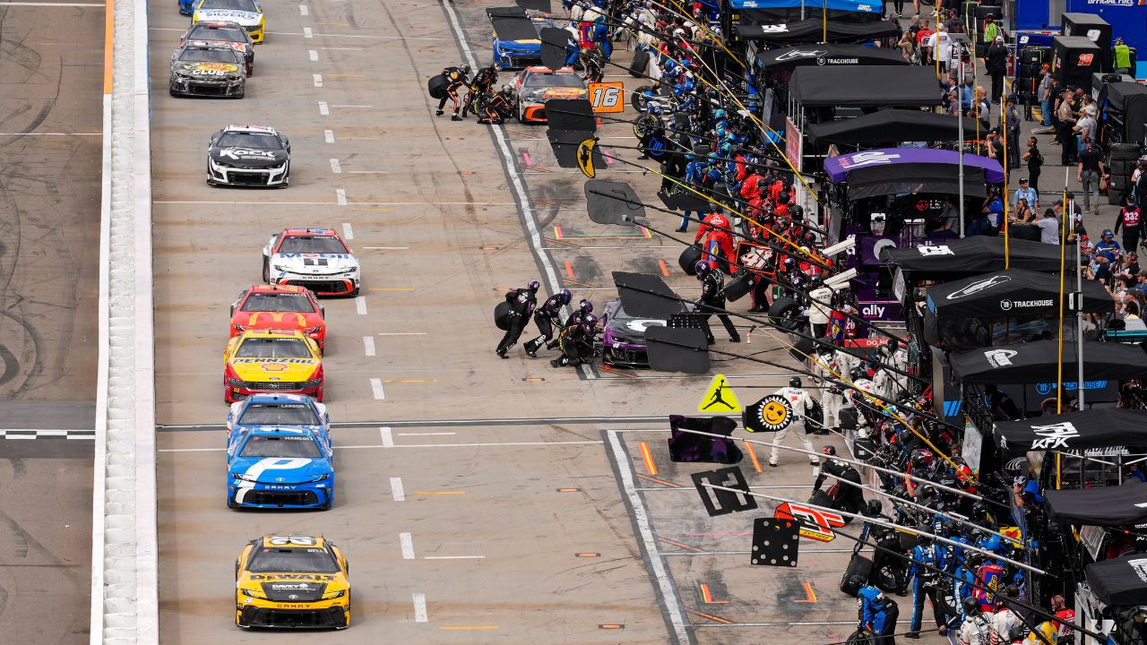 NASCAR cars come down pit road for service during the Cook Out 400 at Martinsville Speedway.