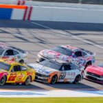 NASCAR Cup Series driver Joey Logano (22) leads the pack going into turn one at Talladega Superspeedway.