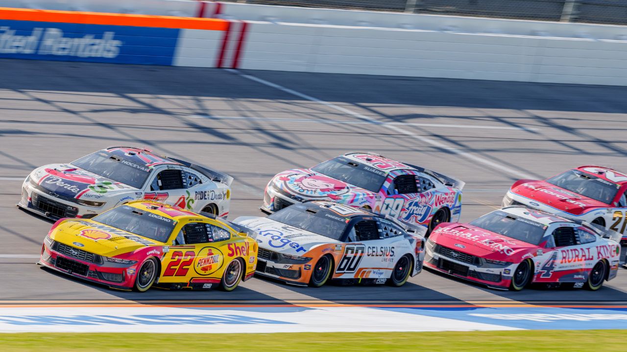NASCAR Cup Series driver Joey Logano (22) leads the pack going into turn one at Talladega Superspeedway.