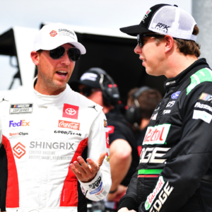 NASCAR Cup Series driver Denny Hamlin (11) speaks with driver Brad Keselowski (6) during qualifying for the United Rentals Work United 500 at Phoenix Raceway.