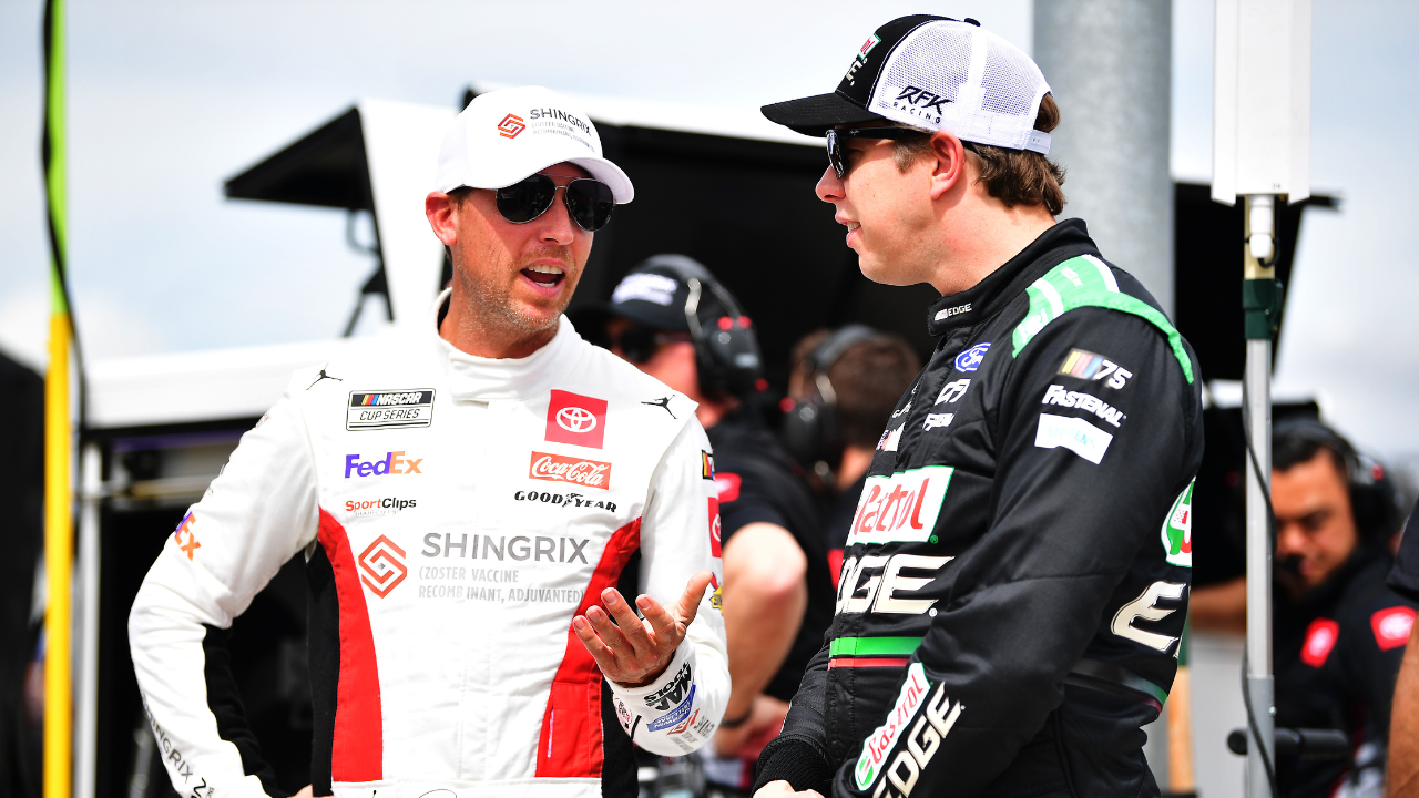 NASCAR Cup Series driver Denny Hamlin (11) speaks with driver Brad Keselowski (6) during qualifying for the United Rentals Work United 500 at Phoenix Raceway.