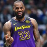 Los Angeles Lakers forward LeBron James (23) laughs during the first half against the Dallas Mavericks at American Airlines Center