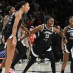 May 23, 2025; Las Vegas, Nevada, USA; Las Vegas Aces center A'ja Wilson (22), guard Jackie Young (0), guard Chelsea Gray (12), guard Dana Evans (11) and Jewell Loyd (24) celebrate defeating the Washington Mystics at Michelob Ultra Arena. Mandatory Credit: Candice Ward-Imagn Images