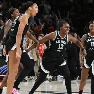May 23, 2025; Las Vegas, Nevada, USA; Las Vegas Aces center A'ja Wilson (22), guard Jackie Young (0), guard Chelsea Gray (12), guard Dana Evans (11) and Jewell Loyd (24) celebrate defeating the Washington Mystics at Michelob Ultra Arena. Mandatory Credit: Candice Ward-Imagn Images