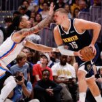 Denver Nuggets center Nikola Jokic (15) controls the ball under pressure from Oklahoma City Thunder forward Jaylin Williams (6) in the second quarter during game four of the second round of the 2025 NBA Playoffs at Ball Arena.