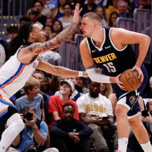 Denver Nuggets center Nikola Jokic (15) controls the ball under pressure from Oklahoma City Thunder forward Jaylin Williams (6) in the second quarter during game four of the second round of the 2025 NBA Playoffs at Ball Arena.