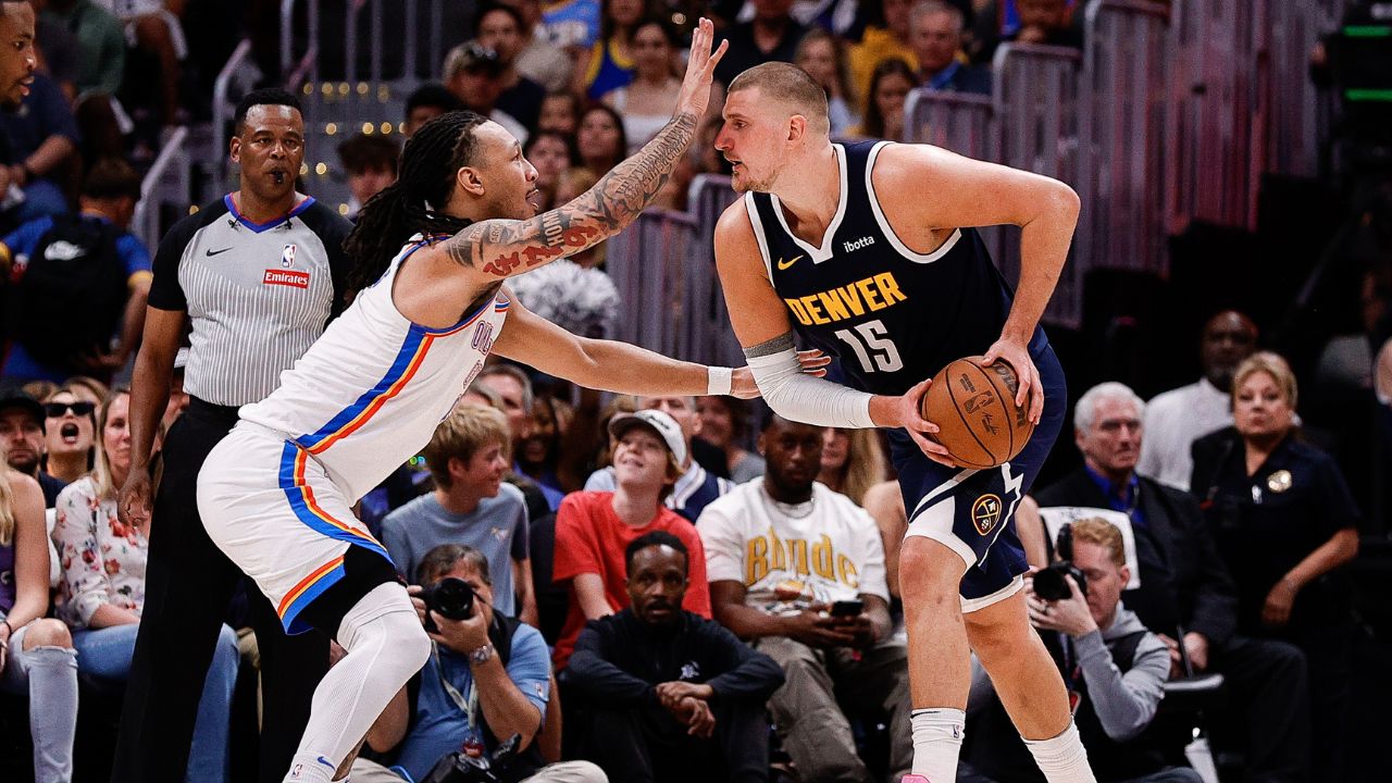 Denver Nuggets center Nikola Jokic (15) controls the ball under pressure from Oklahoma City Thunder forward Jaylin Williams (6) in the second quarter during game four of the second round of the 2025 NBA Playoffs at Ball Arena.
