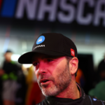 Feb 13, 2025; Daytona Beach, Florida, USA; NASCAR Cup Series driver Jimmie Johnson (84) during driver introductions for the Duels at Daytona International Speedway. Mandatory Credit: Peter Casey-Imagn Images