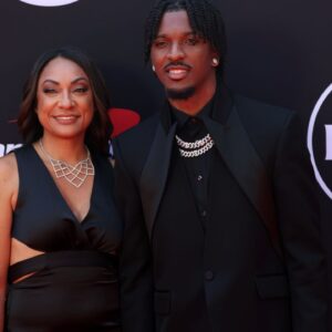 Washington Commanders quarterback Jayden Daniels and his mother Regina Jackson arrive on the red carpet before the 2024 ESPYS at Dolby Theatre.