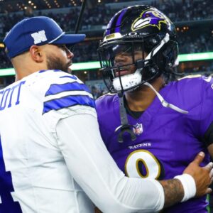 Dallas Cowboys quarterback Dak Prescott (4) hugs Baltimore Ravens quarterback Lamar Jackson (8) after the game at AT&T Stadium.