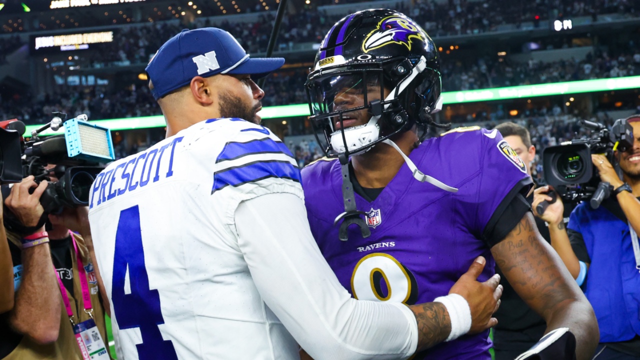 Dallas Cowboys quarterback Dak Prescott (4) hugs Baltimore Ravens quarterback Lamar Jackson (8) after the game at AT&T Stadium.