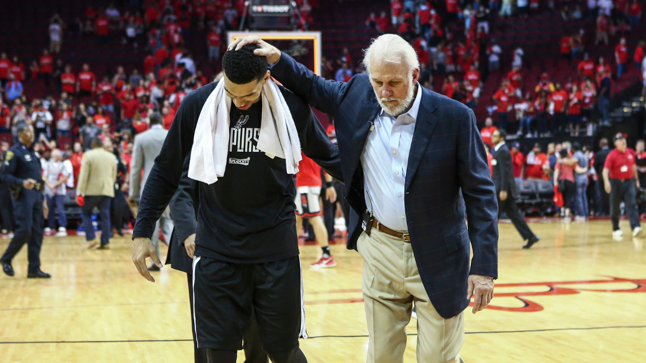 San Antonio Spurs guard Danny Green (14) and head coach Gregg Popovich (R) walk off the court after defeating the Houston Rockets in game six of the second round of the 2017 NBA Playoffs