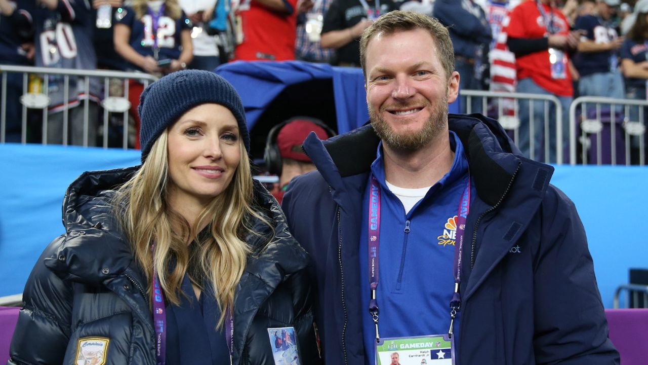 NASCAR retired driver Dale Earnhardt, Jr. and wife Amy Reimann in attendance before Super Bowl LII between the Philadelphia Eagles and the New England Patriots at U.S. Bank Stadium.
