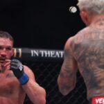 Charles Oliveira (red gloves) fights Michael Chandler (blue gloves) in the lightweight bout during UFC 309 at Madison Square Garden.