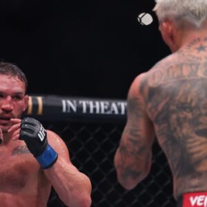 Charles Oliveira (red gloves) fights Michael Chandler (blue gloves) in the lightweight bout during UFC 309 at Madison Square Garden.