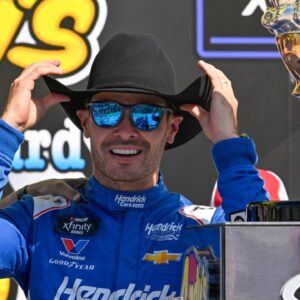 NASCAR Xfinity Series driver Kyle Larson (88) tries on a cowboy hat in Victory Lane after he wins the NASCAR Xfinity race at Texas Motor Speedway.