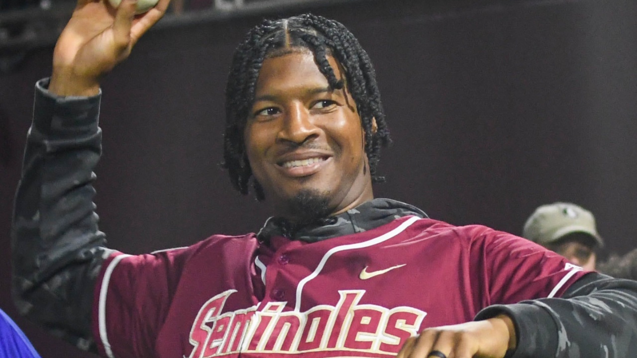Former Florida State quarterback and baseball player Jameis Winston warms up ahead of throwing the first pitch for a game on March 10, 2023.