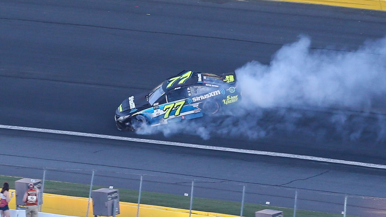 Monster Energy NASCAR Cup Series driver Erik Jones (77) keeps his car under control in turn 1 during the Monster Energy Open at Charlotte Motor Speedway.