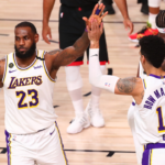 Los Angeles Lakers forward LeBron James (23) celebrates with guard Danny Green