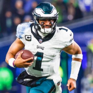 Dec 18, 2023; Seattle, Washington, USA; Philadelphia Eagles quarterback Jalen Hurts (1) rushes against the Seattle Seahawks during the second quarter at Lumen Field.
