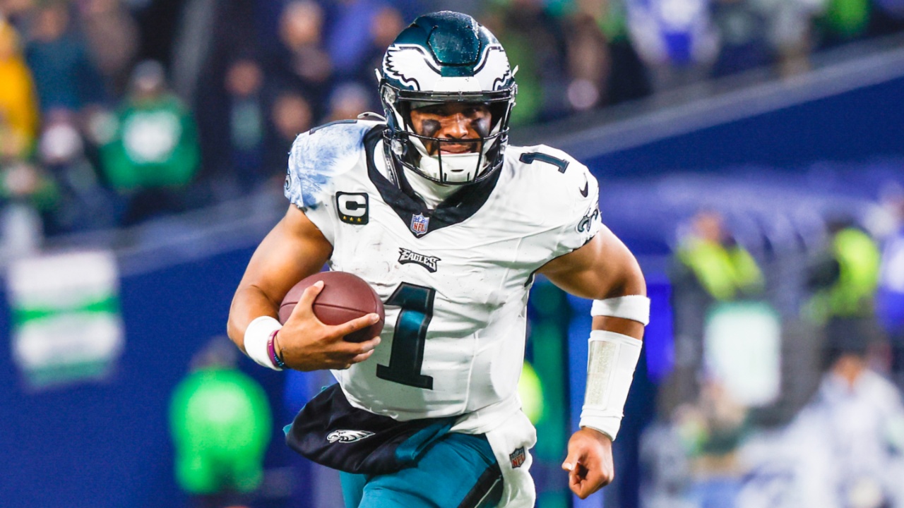 Dec 18, 2023; Seattle, Washington, USA; Philadelphia Eagles quarterback Jalen Hurts (1) rushes against the Seattle Seahawks during the second quarter at Lumen Field.