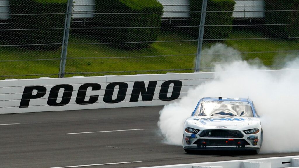 Chase Briscoe (98) celebrates after winning the Pocono Green 225 Recycled Xfinity at Pocono Raceway.