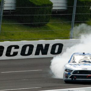 Chase Briscoe (98) celebrates after winning the Pocono Green 225 Recycled Xfinity at Pocono Raceway.