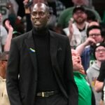 Former Boston Celtic Kevin Garnett reacts to Boston Celtics shooting guard Jaylen Brown (7) dunk (not pictured) during the first half against the Dallas Mavericks at TD Garden.