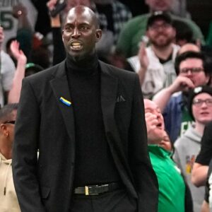 Former Boston Celtic Kevin Garnett reacts to Boston Celtics shooting guard Jaylen Brown (7) dunk (not pictured) during the first half against the Dallas Mavericks at TD Garden.