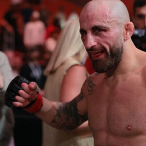 Alexander Volkanovski (red gloves) reacts after defeating Diego Lopes (not pictured) during UFC 314 at Kaseya Center.