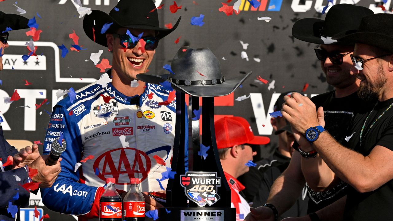 NASCAR Cup Series driver Joey Logano (22) celebrates in victory lane with the winner’s trophy after he wins the Wurth 400 race at Texas Motor Speedway.