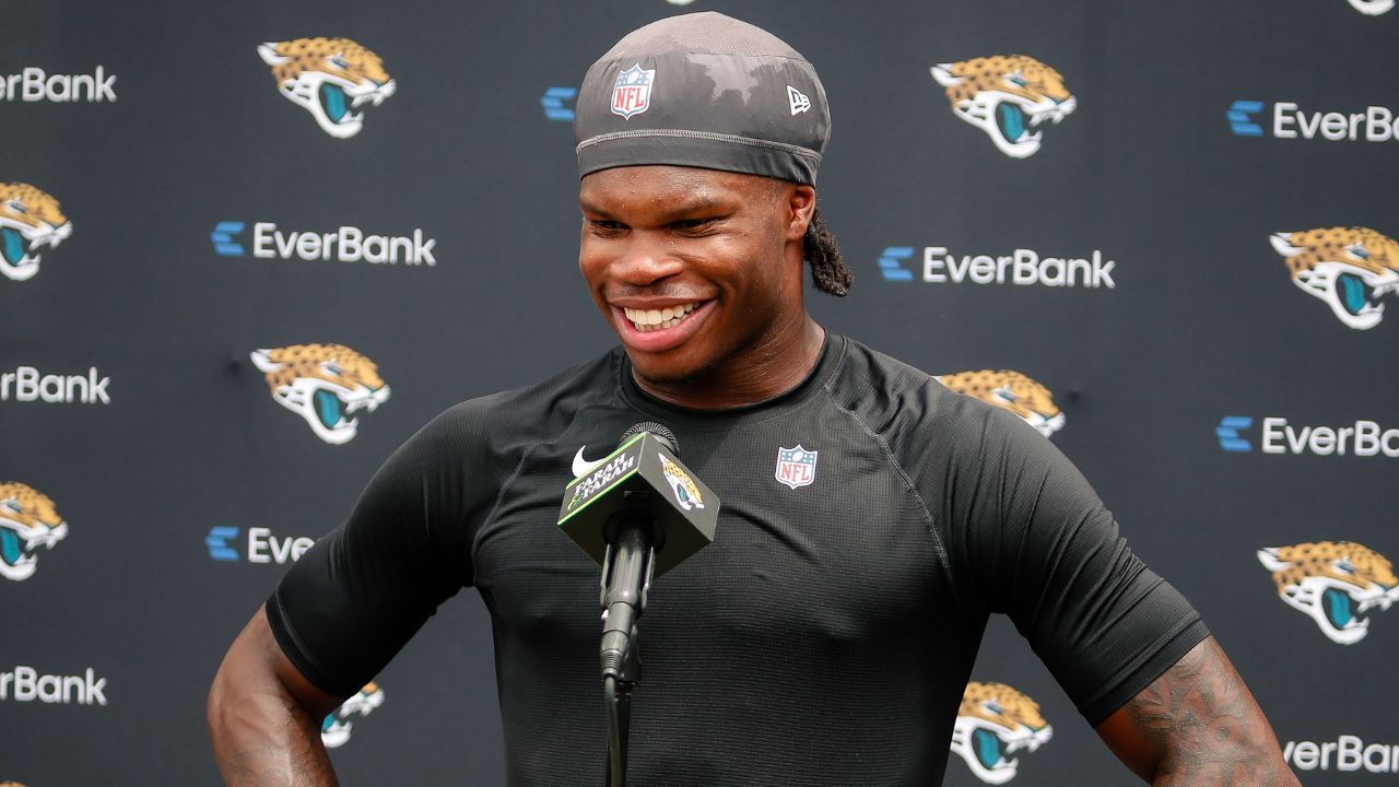 Jacksonville Jaguars wide receiver Travis Hunter (12) meets with the media following rookie minicamp at Miller Electric Center.