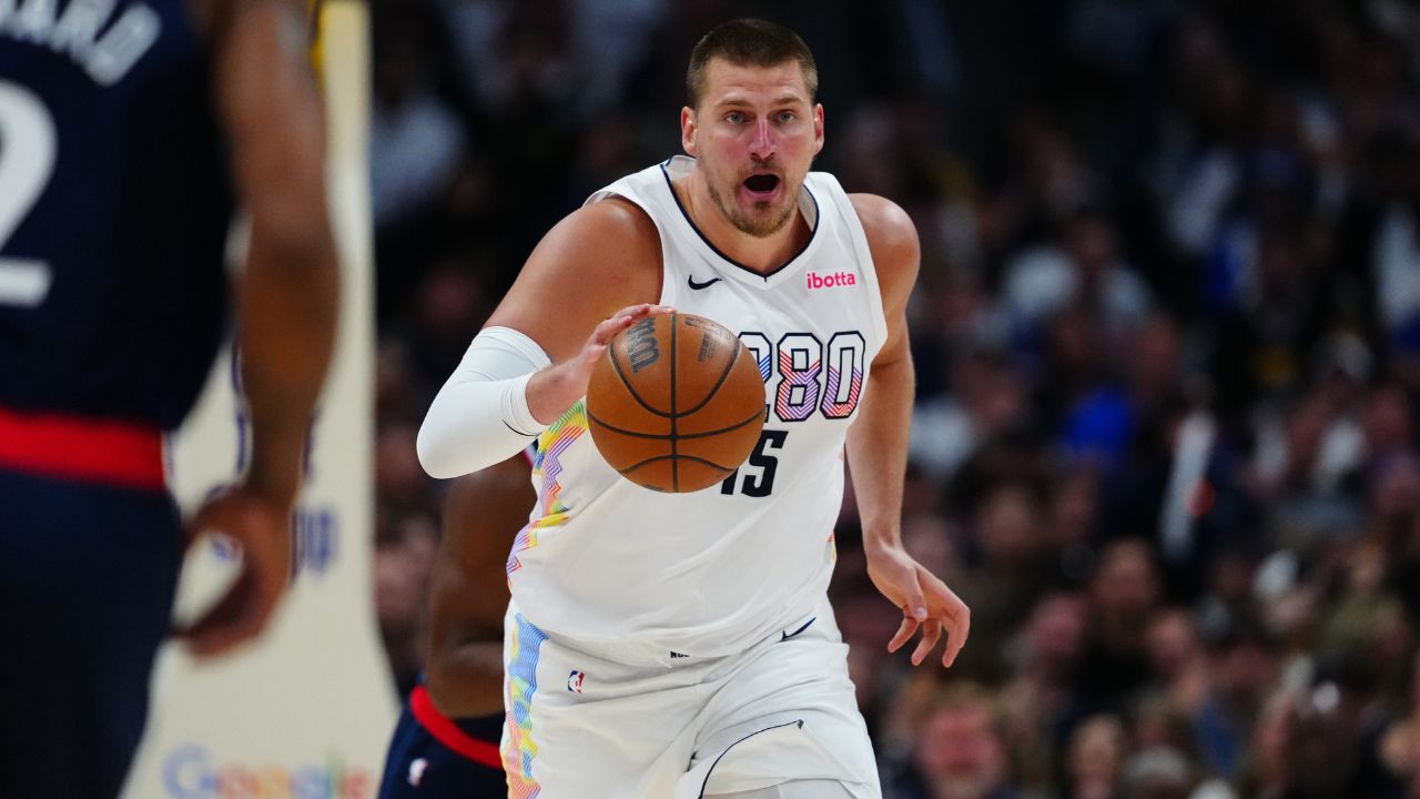 Apr 29, 2025; Denver, Colorado, USA; Denver Nuggets center Nikola Jokic (15) dribbles in the second half against the LA Clippers during game five of the first round for the 2025 NBA Playoffs at Ball Arena. Mandatory Credit: Ron Chenoy-Imagn Images